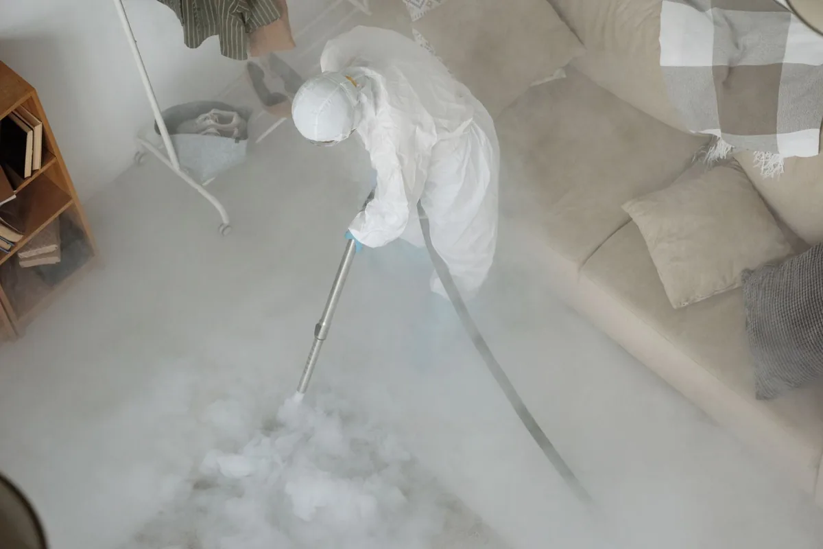 Biohazard cleanup technician in protective equipment, Shenandoah Homes, San Antonio, TX